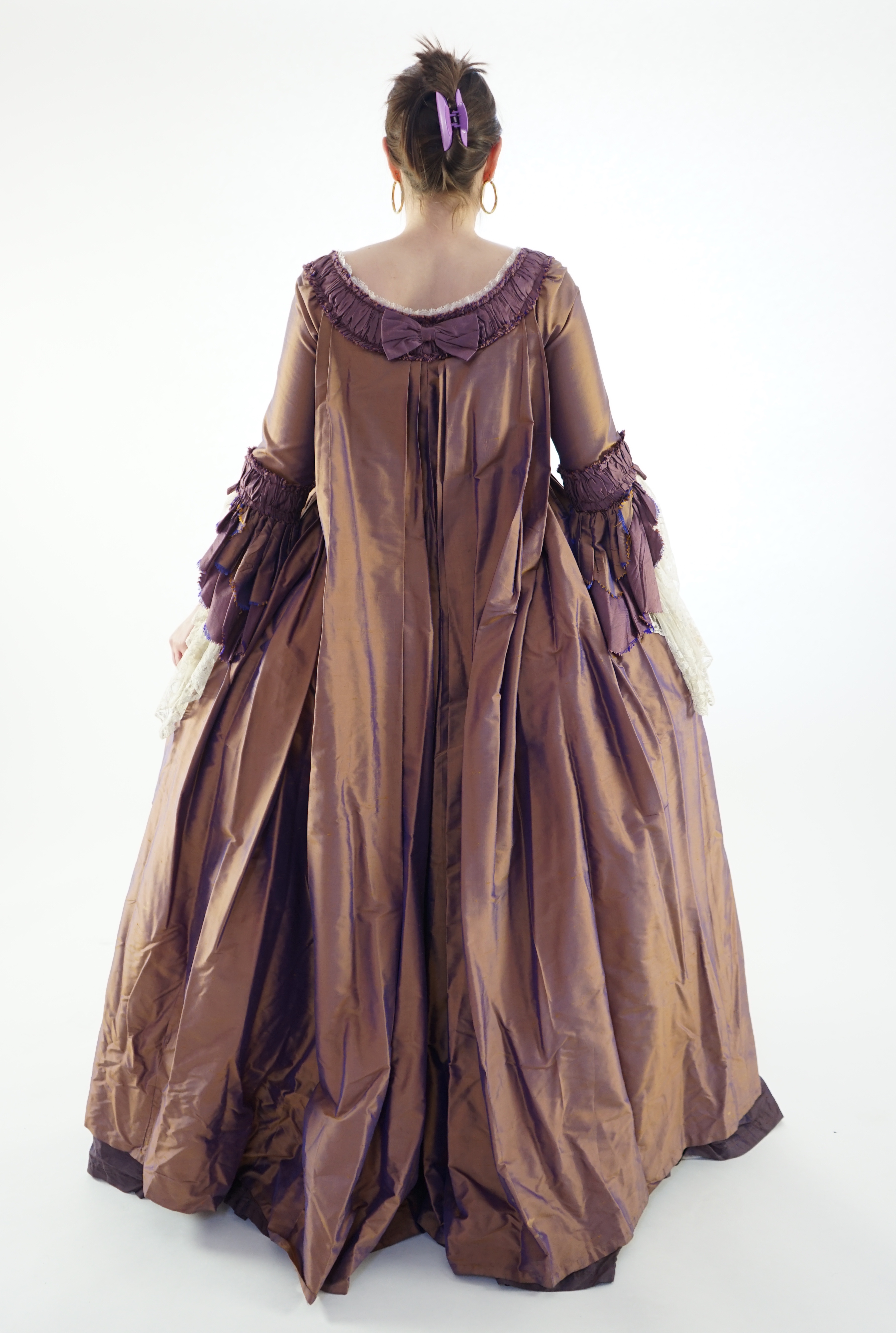 An exceptional lady's 18th century style sack dress, bronze and purple with fine lace cuffs - with skirt and pannier frame. Ex London Festival Opera 'The Magic Flute'.